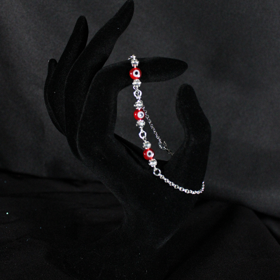 Pulsera plata. 925 ojitos